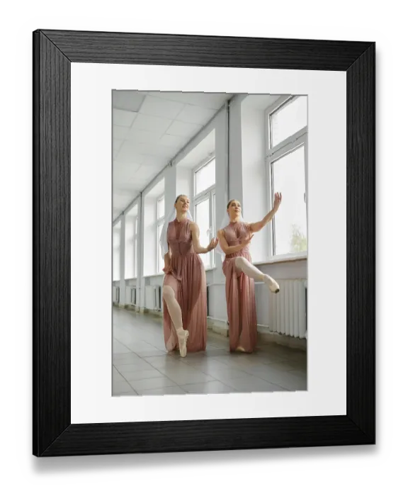 Framed Print : Female ballerinas use a free minute to repeat exercises