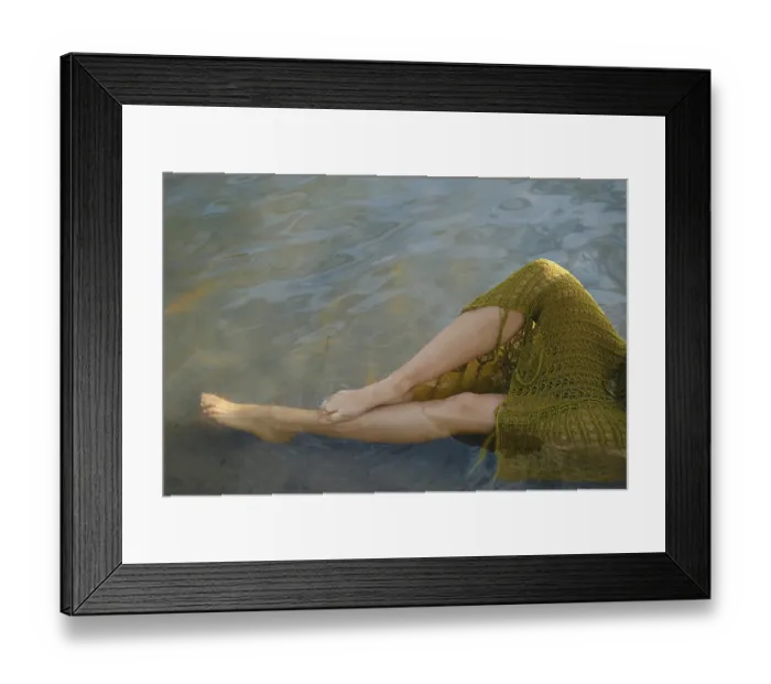 Framed Print : On a warm day, a person relaxes by the lake