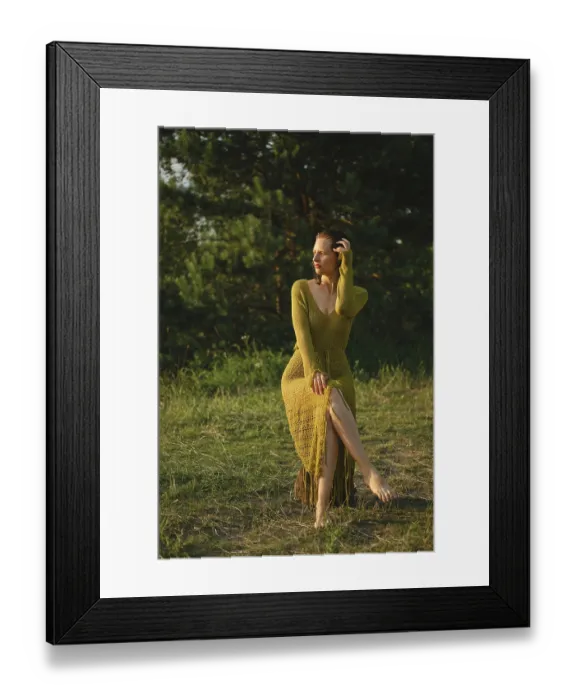 Framed Print : On a warm day, a woman sits gracefully by the lake surrounded by lush greenery Framed Print : On a warm day, a woman sits gracefully by the lake surrounded by lush greenery
