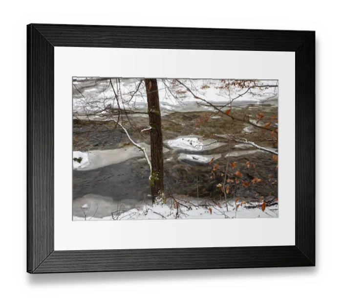 Framed Print : A river surrounded by snow-covered trees with icy banks in winter Upper Kamptal Waldviertel Lower Austria Austria