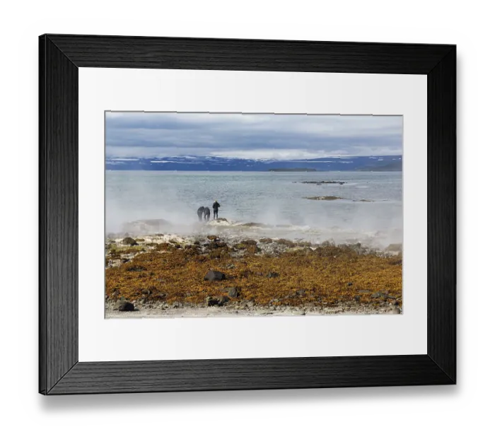 Framed Print : Hot spring flows into the sea, tourists on the steaming rocky coast near Reykjanes Framed Print : Hot spring flows into the sea, tourists on the steaming rocky coast near Reykjanes