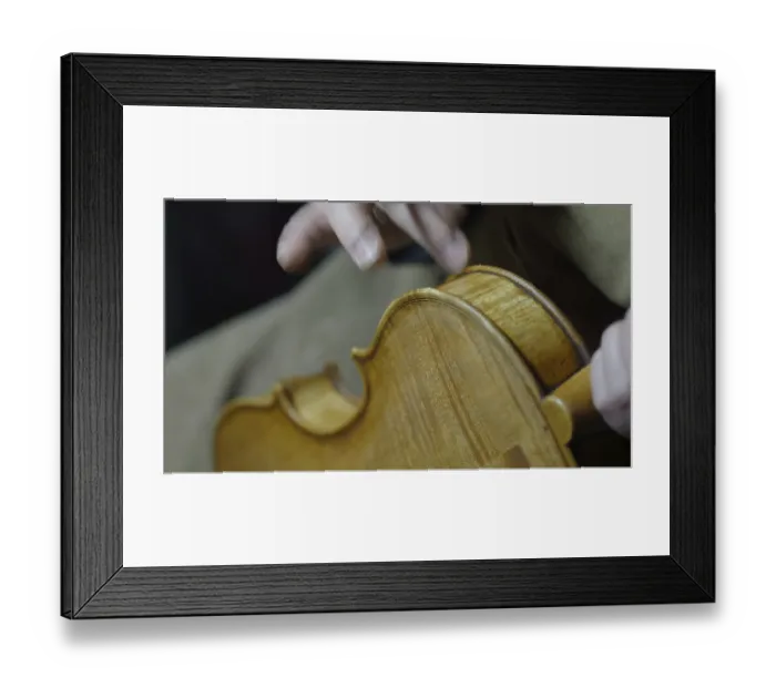 Framed Print : Close-up of hands crafting a violin