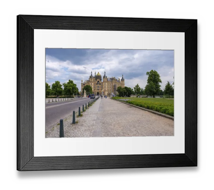 Framed Print : A picturesque castle with towers under a cloudy sky