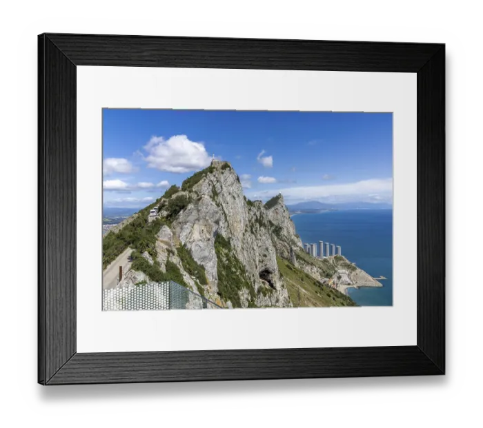 Framed Print : The tip of the Rock of Gibraltar and in the background the Hassan Centenary Terraces residential complex