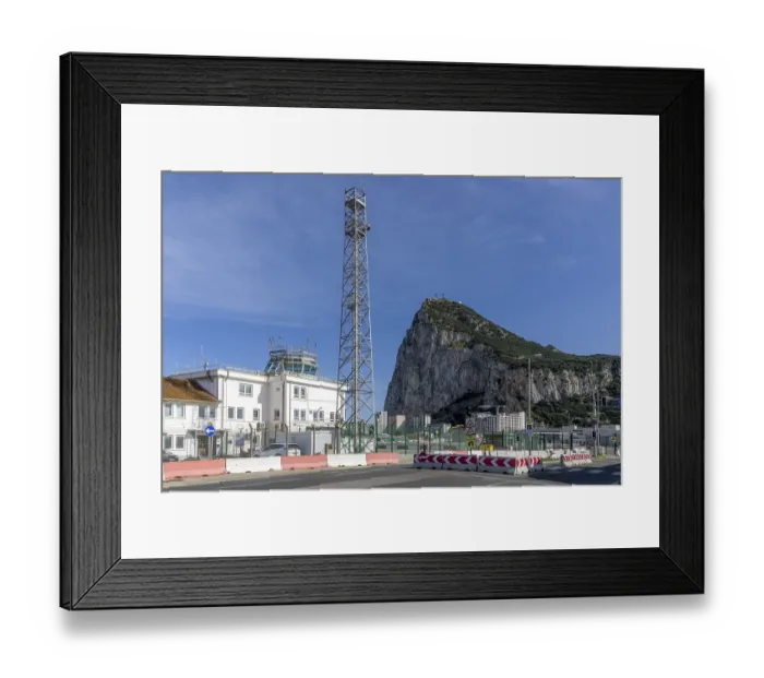 Framed Print : Building of the Gibraltar Airport Control Centre and in the background Rock of Gibraltar