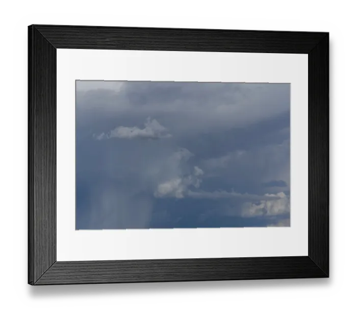 Framed Print : Dark storm clouds gather in the sky over a vast rural landscape