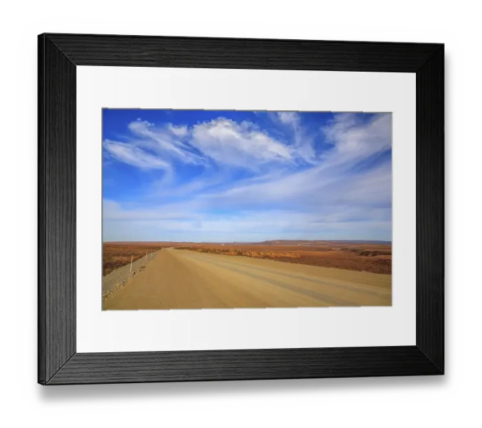 Framed Print : The Dempster Highway crossing the arctic tundra just north of the Yukon border