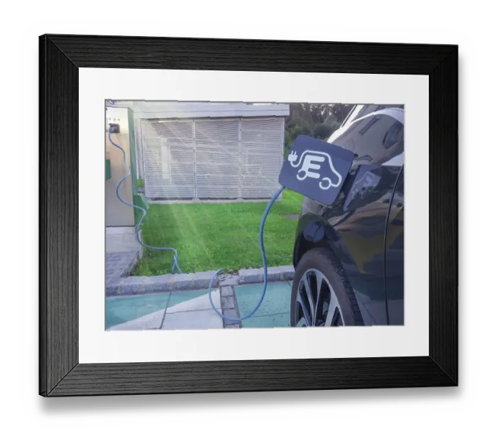 Framed Print : Modern electric car plugged