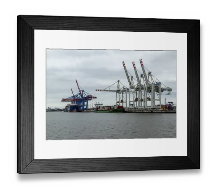 Framed Print : Container ships and container gantry cranes under grey skies on the Elbe at the Tollerort container terminal