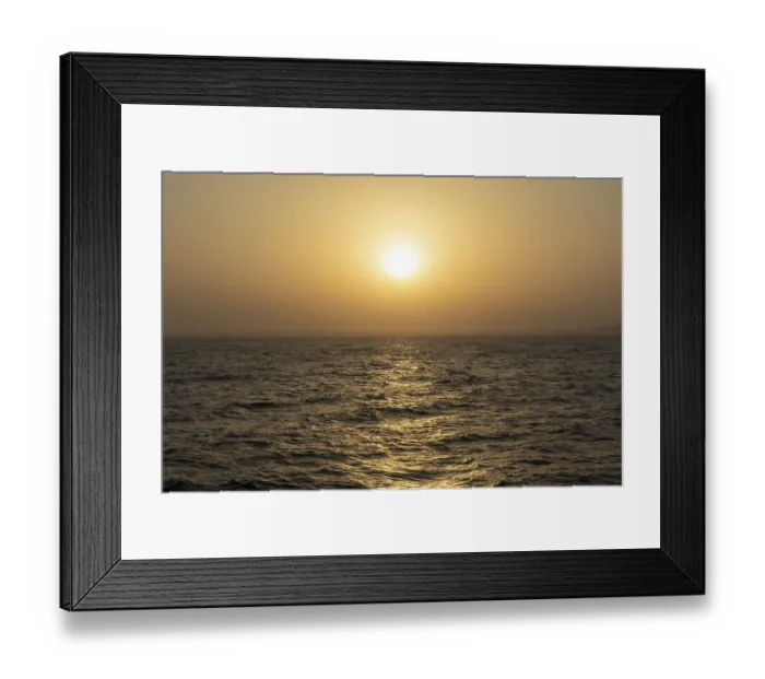 Framed Print : Background image, setting sun with silhouette of land Framed Print : Background image, setting sun with silhouette of land