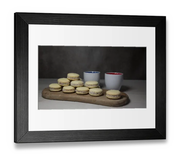 Framed Print : A stack of tasty alfajores cookies with coconut filling displayed on a wooden board