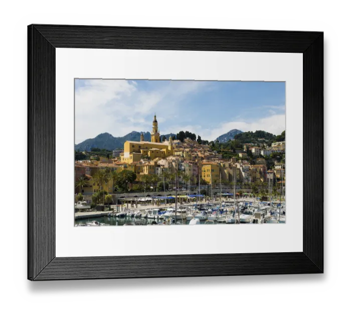 Framed Print : Town with colourful houses by the sea