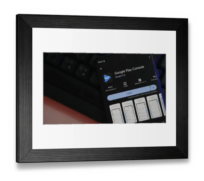 Framed Print : Smartphone displaying Google Play Console app interface Framed Print : Smartphone displaying Google Play Console app interface