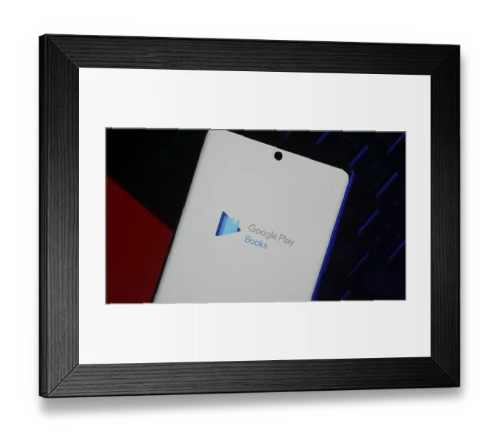 Framed Print : Smartphone displaying Google Play Books app logo on screen against a dark background