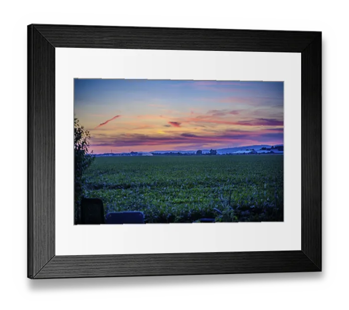 Framed Print : A picturesque sunset paints the sky in vivid colours