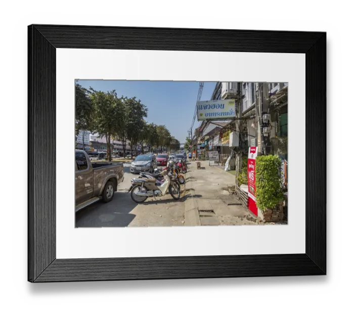 Framed Print : Cars and scooters double parked along Ban Du street in Chiang Rai