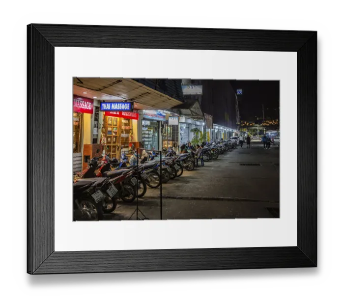 Framed Print : Massage parlor employees waiting for customers along a street in Chiang Rai