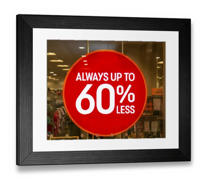 Framed Print : Always up to 60% less sale sign in TK Maxx shop window