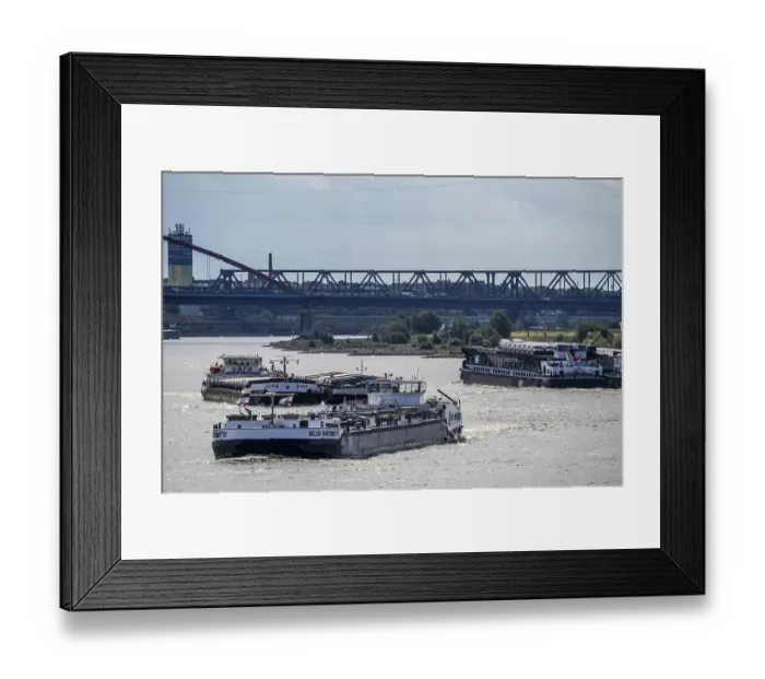 Framed Print : Cargo ships on the Rhine, in the background the Rhine bridge near Duisburg-Rheinhausen Framed Print : Cargo ships on the Rhine, in the background the Rhine bridge near Duisburg-Rheinhausen