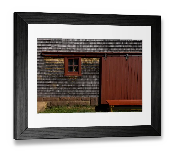 Framed Print : The exterior of an old barn and door