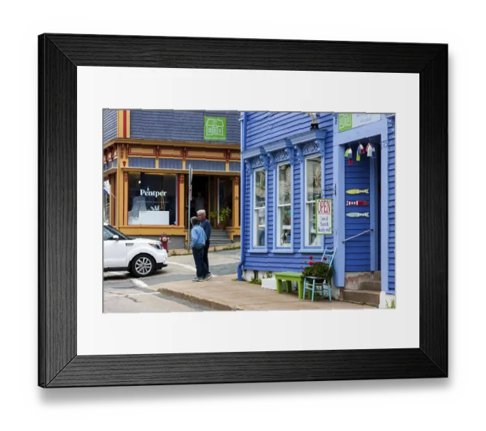 Framed Print : People walking past colorful buildings with quaint architectural details in Lunenburg