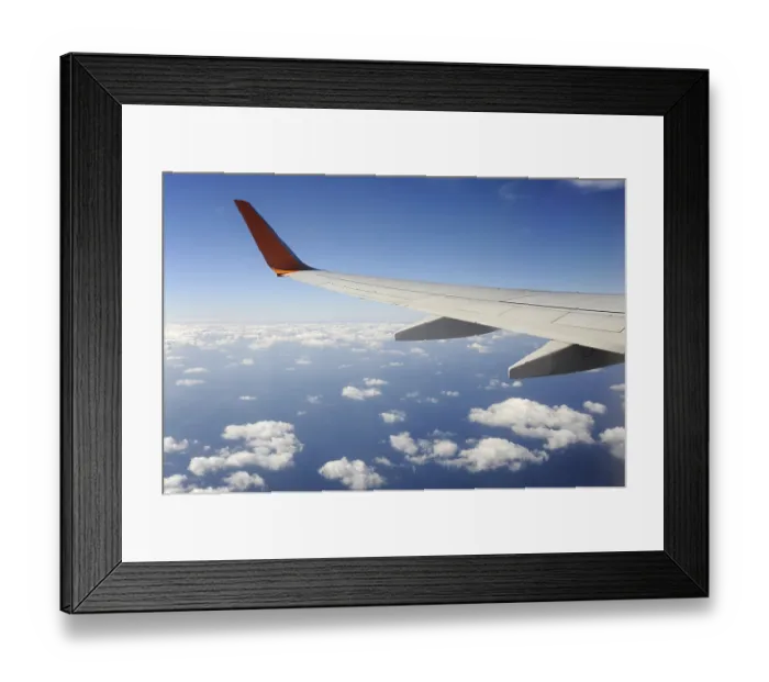 Framed Print : Silver wing, Boeing 737-800 aeroplane flying over the clouds Framed Print : Silver wing, Boeing 737-800 aeroplane flying over the clouds