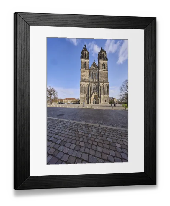 Framed Print : Cathedral, cobblestone square, blue sky