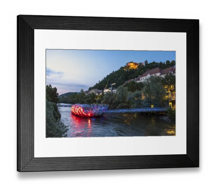 Framed Print : Night-time view of the Murinsel floating island on the river Mur with Schlossberg castle hill in the background