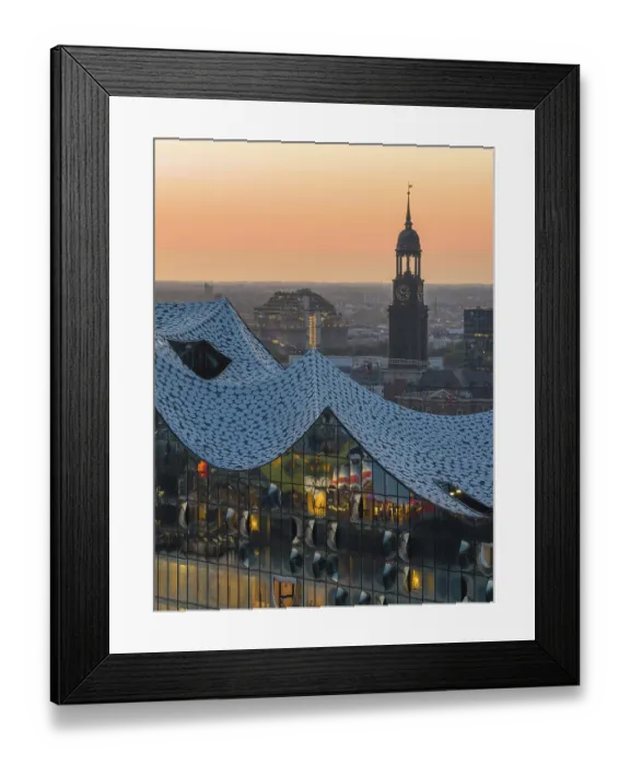 Framed Print : Aerial view of the Elbphilharmonie at sunset with illuminated windows and view over Hamburg