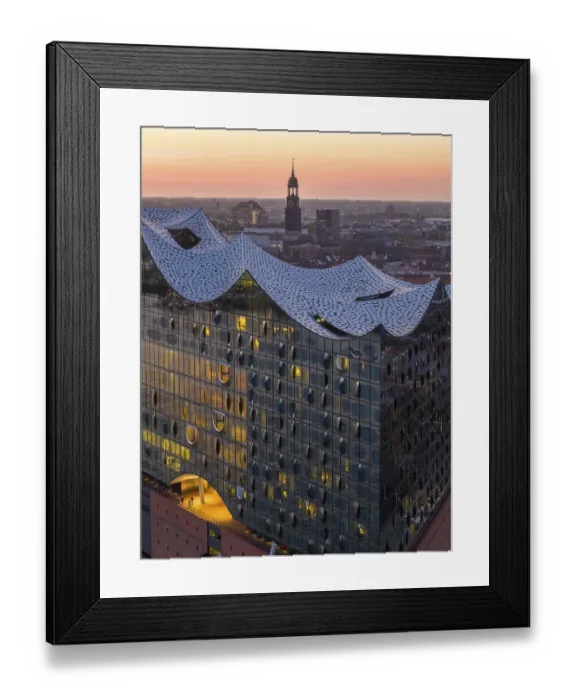 Framed Print : Aerial view of the Elbphilharmonie at sunset with illuminated windows and view over Hamburg