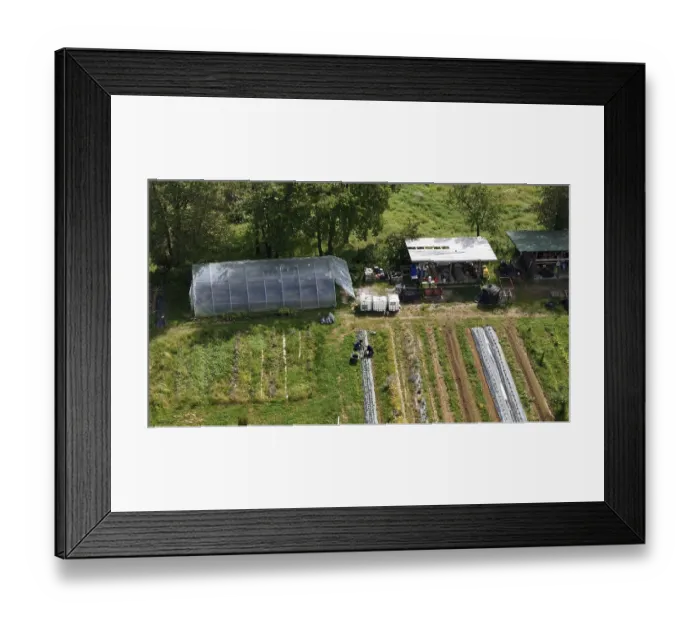 Framed Print : Aerial View of a Sustainable Farm with a Greenhouse Barn Structure