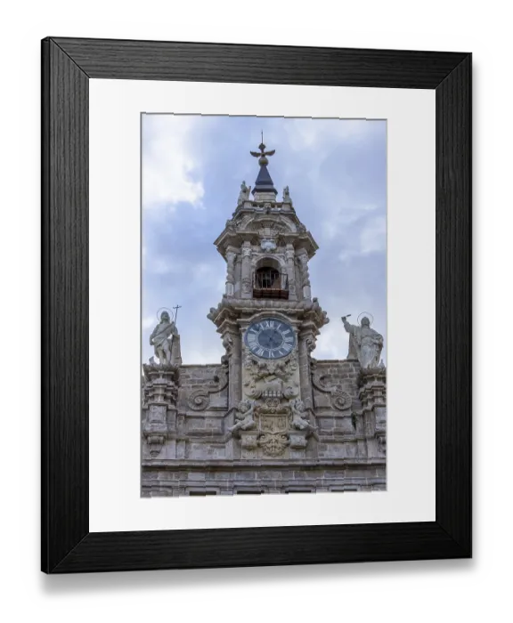 Framed Print : The richly decorated top of the facade of the old Catholic Real Parroquia de los Santos Juanes Valencia in Pl