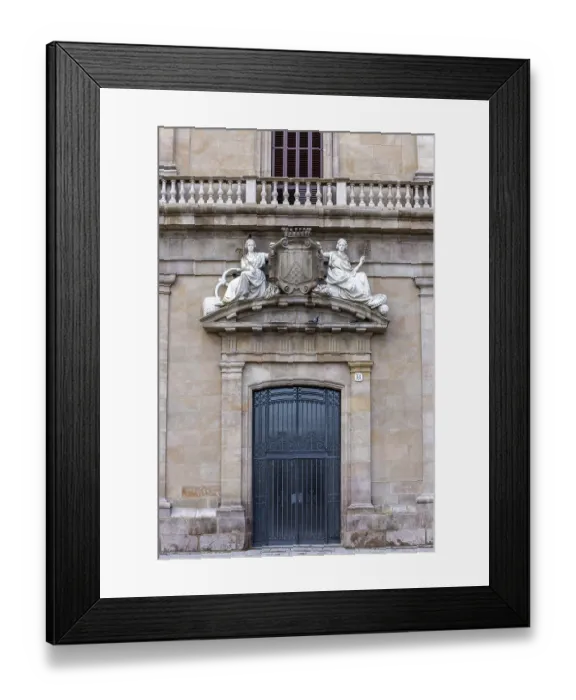 Framed Print : Entrance door with sculptures above on a decorative building in La Rambla street