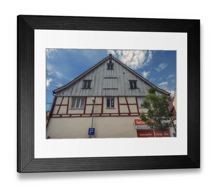 Framed Print : Pointed gable facade with half-timbering and timber panelling Framed Print : Pointed gable facade with half-timbering and timber panelling