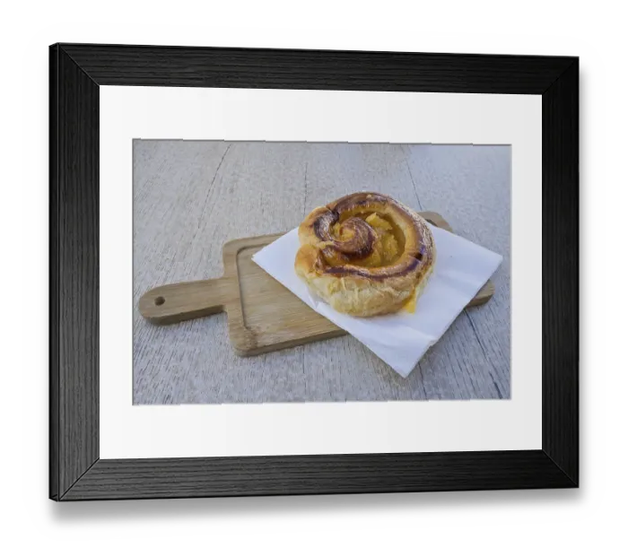 Framed Print : Spanish puff pastry bun filled with orange marmalade