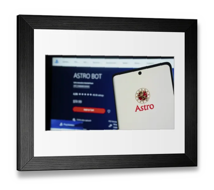 Framed Print : Smartphone with Astro logo on screen next to a digital app interface