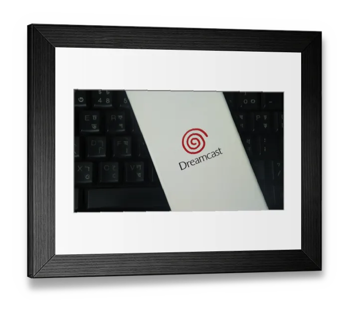 Framed Print : Dreamcast logo on a smartphone with a keyboard backdrop Framed Print : Dreamcast logo on a smartphone with a keyboard backdrop