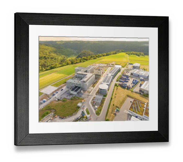 Framed Print : Industrial building under construction with solar panels and surrounding landscape Framed Print : Industrial building under construction with solar panels and surrounding landscape