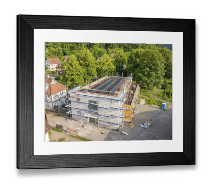 Framed Print : Multi-storey building with solar panels in a green environment