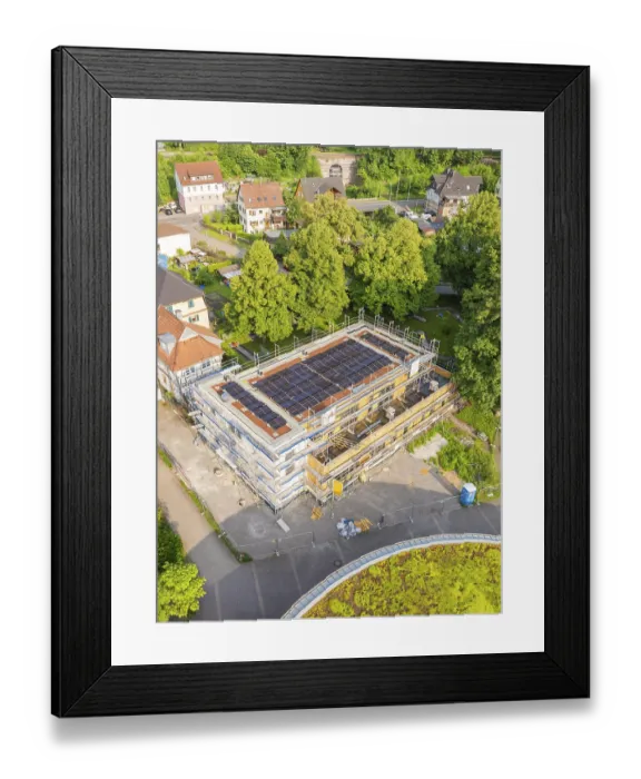 Framed Print : Building with solar panels on the roof
