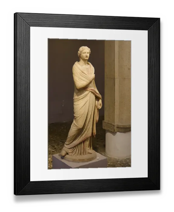 Framed Print : Ancient marble sculpture of a classical woman in a draped robe in the museum