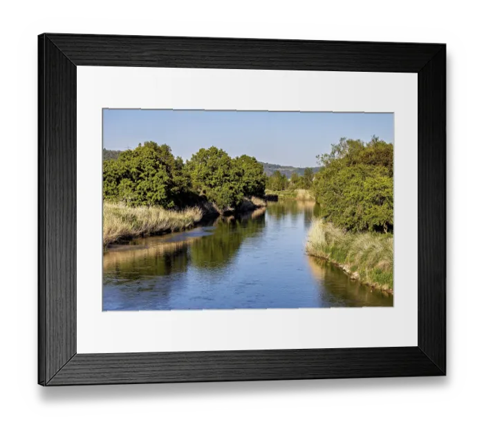 Framed Print : A quiet river, lined with dense trees