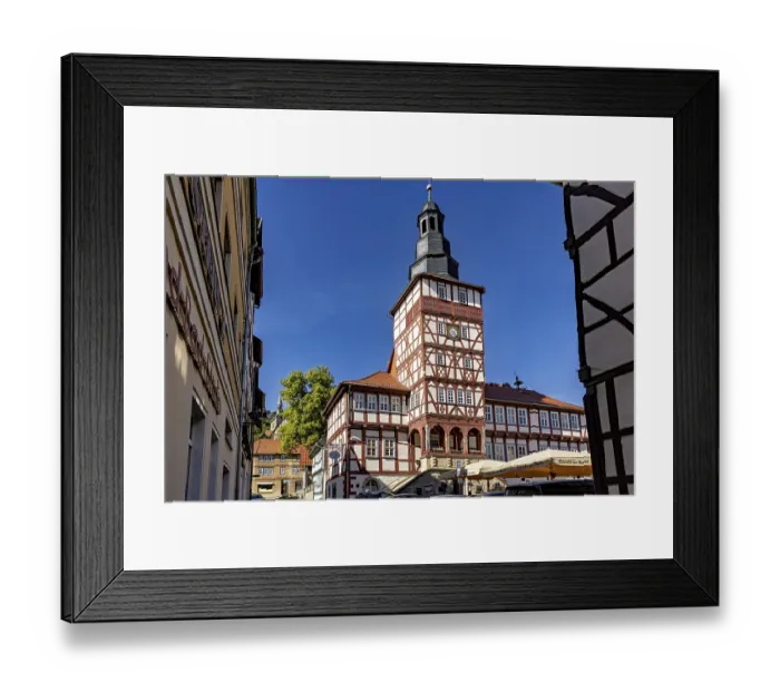 Framed Print : Half-timbered tower and surrounding buildings