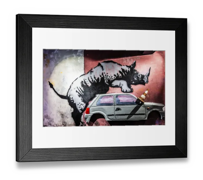 Framed Print : Banksy - Rhino, commentary on urban decay and the intrusion of nature into city life