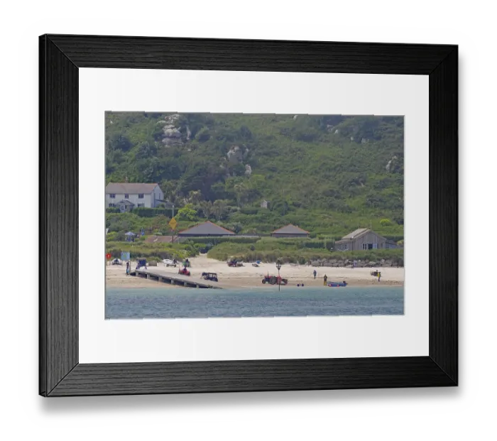 Framed Print : Coastal landscape with beach, houses and green hills in the background Framed Print : Coastal landscape with beach, houses and green hills in the background
