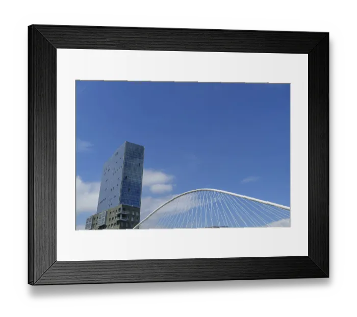 Framed Print : Single skyscraper, bridge, clouds in clear sky