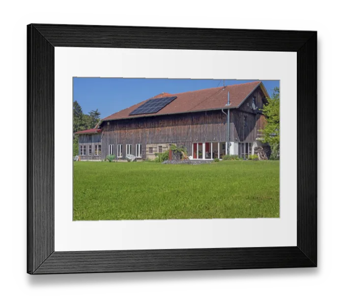Framed Print : Mown spring meadow, barn converted into a residential building with solar panel near Ried