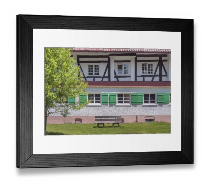 Framed Print : Half-timbered facade with green shutters