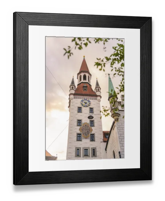 Framed Print : Baroque tower with red roofs and clock in front of a gold-coloured sky Framed Print : Baroque tower with red roofs and clock in front of a gold-coloured sky