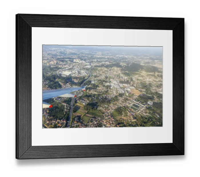 Framed Print : Oblique aerial view from plane window over city of Porto